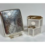 A pair of Birmingham silver octagonal engine turned napkin rings (3cm x 5cm x 3cm) (40.4g) and a