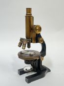 An early 20th century Leitz Wetzlar lacquered brass microscope (marked 'E.LEITZ WETZLAR' (h- 34cm)