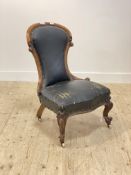 A Victorian walnut framed spoon back slipper chair, scroll carved show frame enclosing rexine