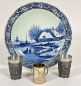 A large Delft scalloped plaque with scene of Frozen Canal with Figures Skating, with Windmill (d.