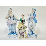 A pair of Dresden porcelain blue figures of a man and woman, the woman with a fruit basket and