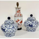 A pair of Chinese porcelain baluster ginger jars and covers with allover scrolling crysanthemum leaf