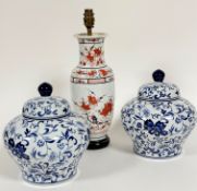 A pair of Chinese porcelain baluster ginger jars and covers with allover scrolling crysanthemum leaf