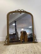 A Victorian giltwood and composition framed over mantel mirror, the arched top and moulded frame