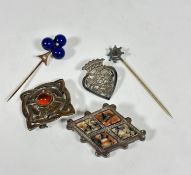 A thistle heart shaped brooch, an Edwardian white metal and yellow metal set stick pin, an Edwardian