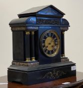 A Victorian slate mantel clock of Palladian form, with cast brass frieze, plain fluted columns on