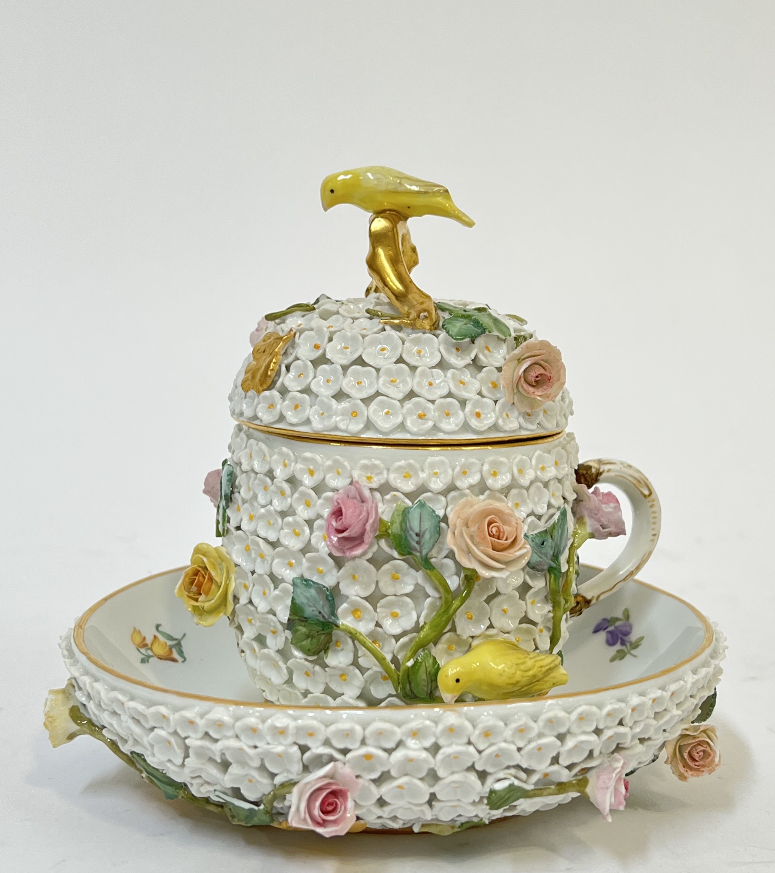 A Meissen Schneeballen porcelain cup, cover and stand, the exterior encrusted with flower heads