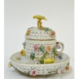 A Meissen Schneeballen porcelain cup, cover and stand, the exterior encrusted with flower heads