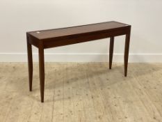 A cherry wood console table by Grange, the panelled top over three frieze drawers, raised on