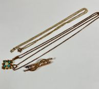 An Edwardian 9ct gold bar brooch with central scroll set nine graduated half seed pearls mounted