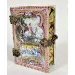An early 19thc French faience pottery box in the form of a hinged book, the cover with cast white