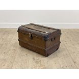 An early 20th century scumbled dome top tin travelling trunk, H42cm, W68cm, D49cm