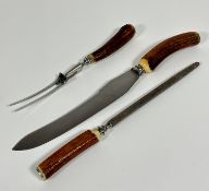 An Epns horn handled three piece carving set including fork, carving knife and steel, missing box