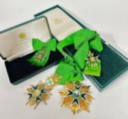 A group of gilt metal and enamelled Maltese Cross regalia on satinised silk style green ribbon,