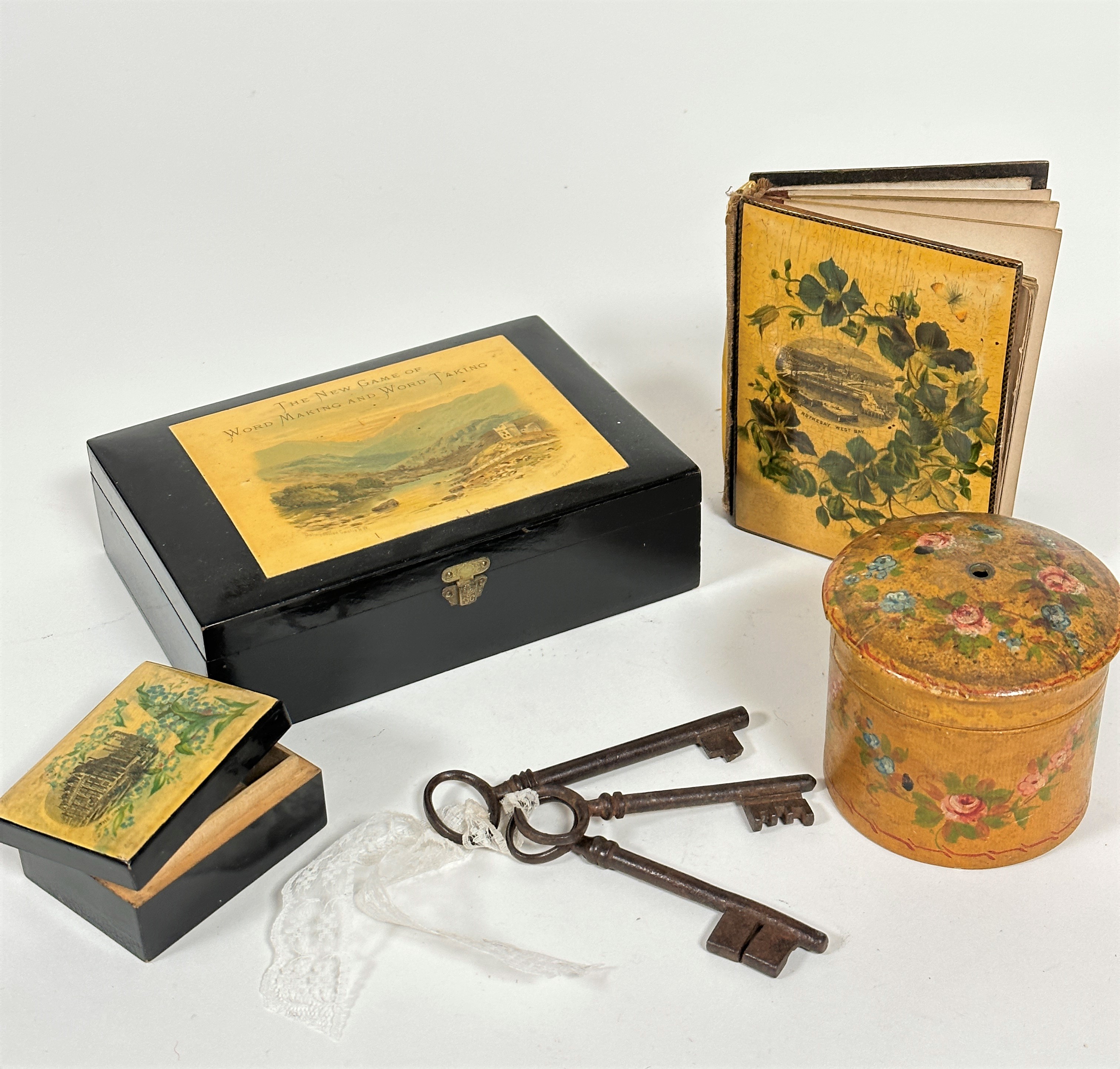 A satinwood ebonised mauchline box, The New Game of Word, Taking (4.5cm x 16.5cm x 11.5cm), a