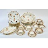 A Coalport Rococo style part desert service decorated with floral sprigs in polychrome enamels and