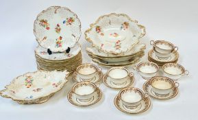 A Coalport Rococo style part desert service decorated with floral sprigs in polychrome enamels and