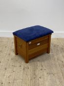 A teak framed sewing box stool, the blue suede upholstered top opening to an interior fitted with