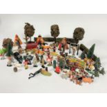 A collection of plastic children's play figures including Native Americans on horseback etc.,
