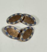 A pair of 9ct rose gold and enamelled oval sleeve links, (2cm x 1cm) (7.03g)