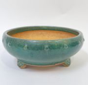 A modern Chinese green crackle glazed circular pottery planter with studded decoration, on three