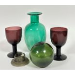 A pair of amethyst large glass goblets on column and spreading base (17cm x d.10cm), a green glass