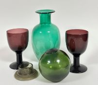 A pair of amethyst large glass goblets on column and spreading base (17cm x d.10cm), a green glass