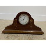 An early 20th century mahogany dome top mantel clock, white enamel dial with Arabic chapter ring,