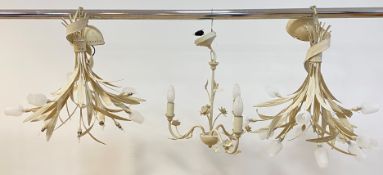 A pair of white painted aluminium multi branch chandeliers formed as inverted tulip bouquets, with