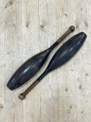 A pair of vintage wooden juggling clubs (h- 56cm) (2)