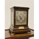 An Edwardian mahogany cased ting tang bracket clock, with bevelled glass to all sides, on brass