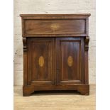 An Edwardian mahogany side cabinet, the frieze drawer and panelled cupboard doors with tulip and