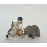 A 1950's Lomonosov Imperial porcelain figure of a boy and husky (h-14cm) and a hand carved figure of