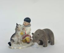 A 1950's Lomonosov Imperial porcelain figure of a boy and husky (h-14cm) and a hand carved figure of