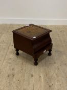 A Victorian mahogany night commode, the hinged top opening to a ceramic bowl, raised on turned