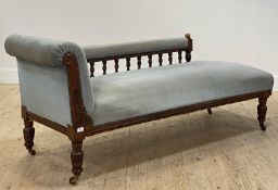 A Victorian chaise longue, the arm ret on a turned spindle gallery, upholstered in blue velvet,