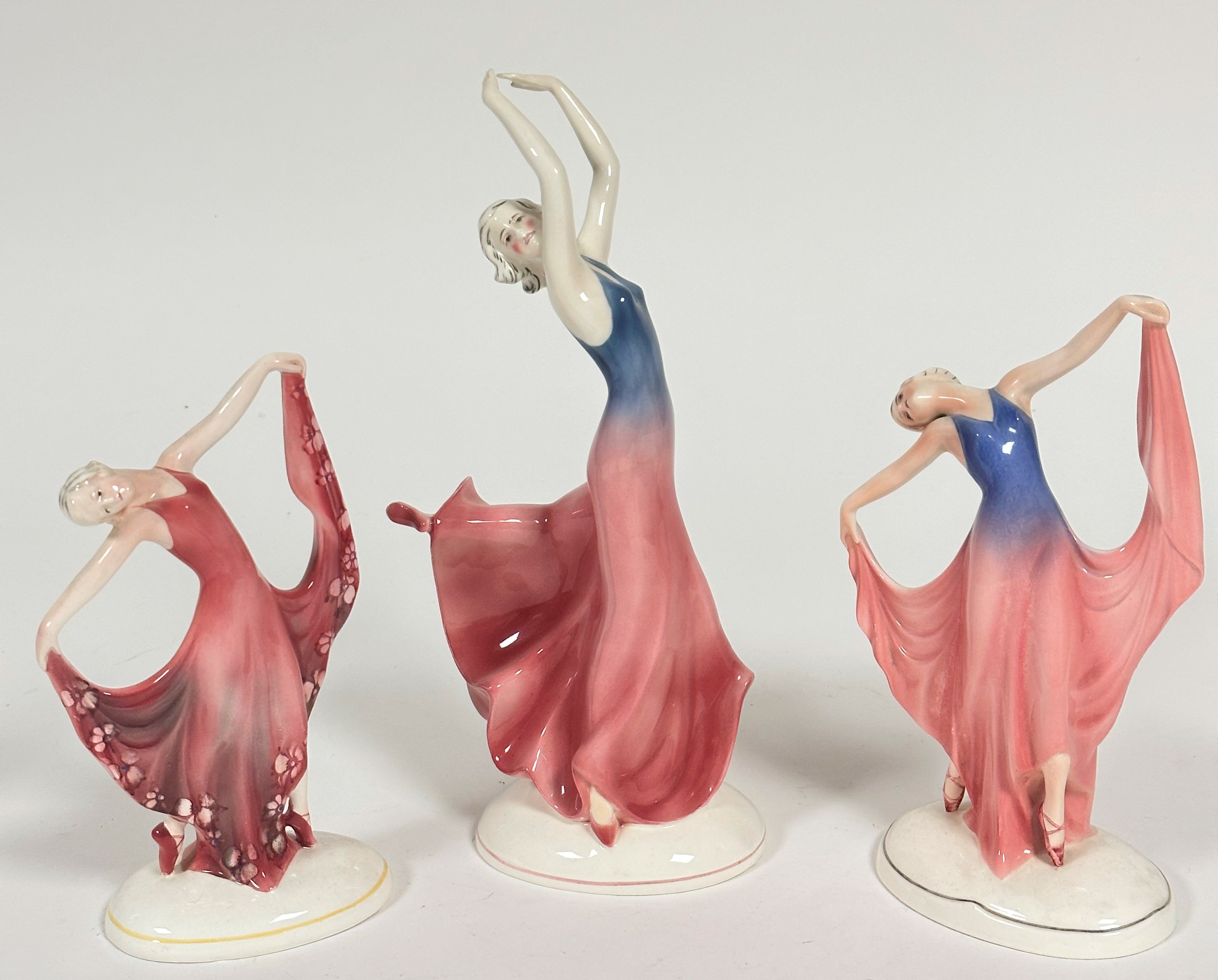 A pair of Katzhutte Art Deco style Standing Figures, both in Evening Dress, Dancing, one with blue