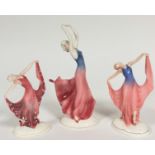 A pair of Katzhutte Art Deco style Standing Figures, both in Evening Dress, Dancing, one with blue
