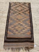 A flat weave rug fragment, possibly North African, 210cm x 104cm