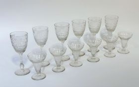 A partial suite of cut and etched glass stemware, early 20th century, comprising six red wine