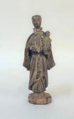 A Continental carved wooden figure of St. Anthony of Padua, probably 17th/early 18th century,