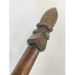 A Maori Taiaha staff, New Zealand, of characteristic form, with carved decoration to the stylised