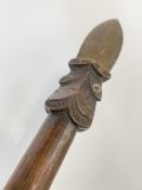 A Maori Taiaha staff, New Zealand, of characteristic form, with carved decoration to the stylised
