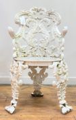 A Victorian cast iron garden seat in the Rococo taste, the back and arm rests formed as scrolling