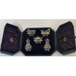 A Victorian cased silver condiment set, James Deakin & Sons, Chester 1895 and 1897, comprising a
