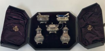 A Victorian cased silver condiment set, James Deakin & Sons, Chester 1895 and 1897, comprising a