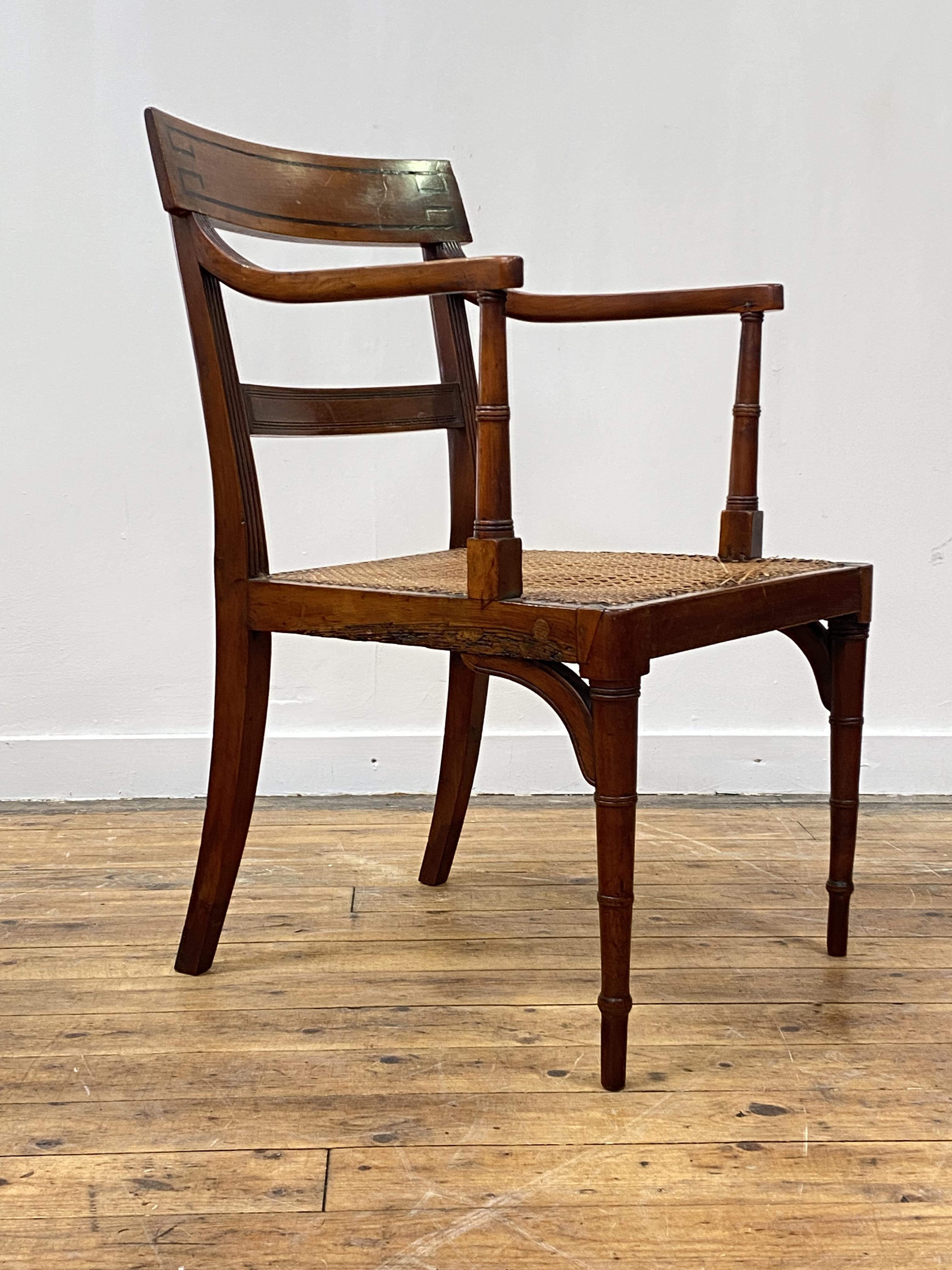 A Regency period yew wood elbow chair, the crest rail inlaid with ebony bands, above reeded open - Image 2 of 5
