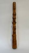 A substantial knotted wooden club, of tapering cylindrical form. Length 88cm