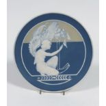 A Villeroy & Boch, Mettlach, pate sur pate wall plate, early 20th century, decorated with a kneeling