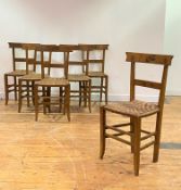 A set of Six Regency painted chairs, the twin rail back over woven string seat, raised on square